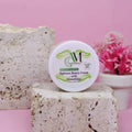 A white round jar of Zafarani Beauty Cream