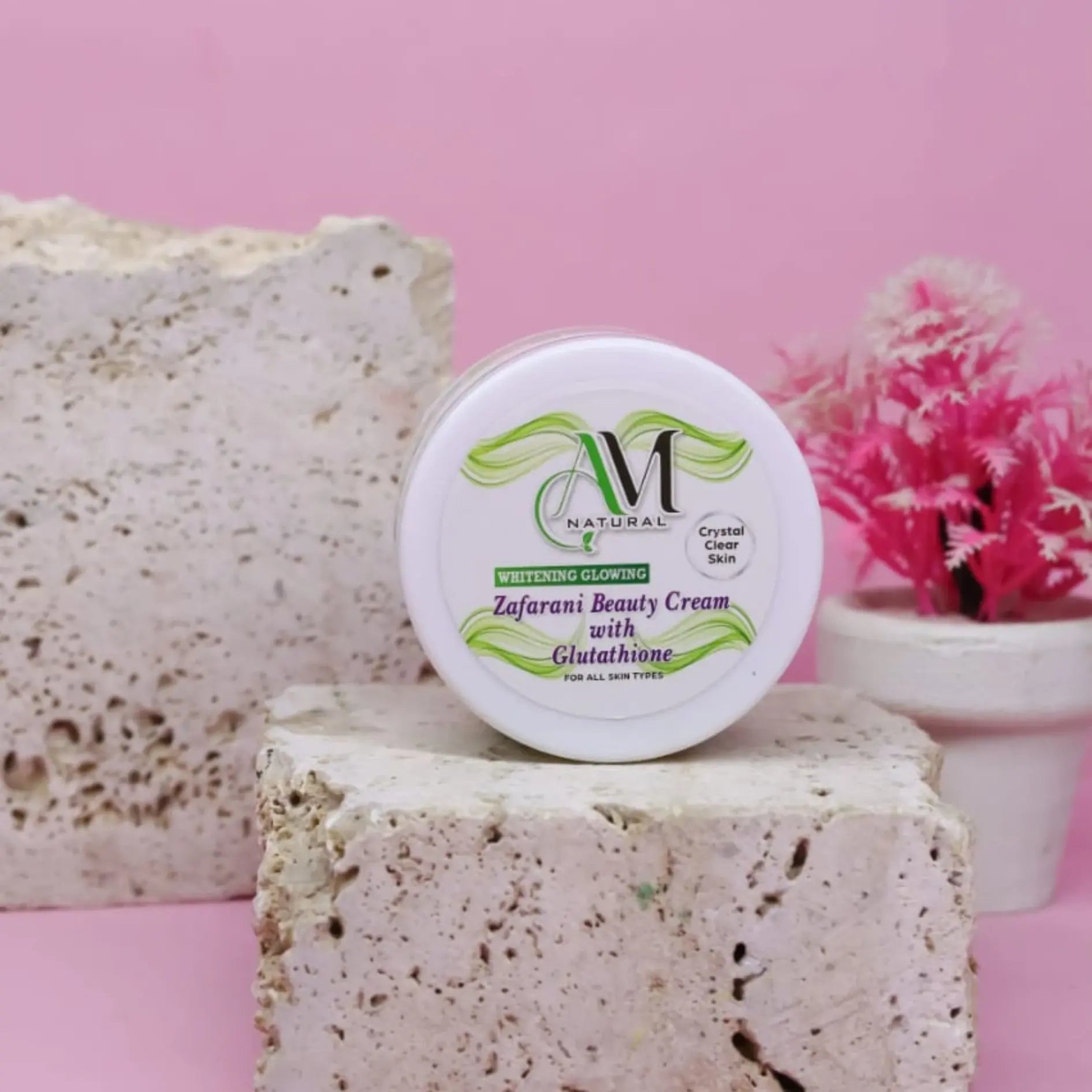 A white round jar of Zafarani Beauty Cream